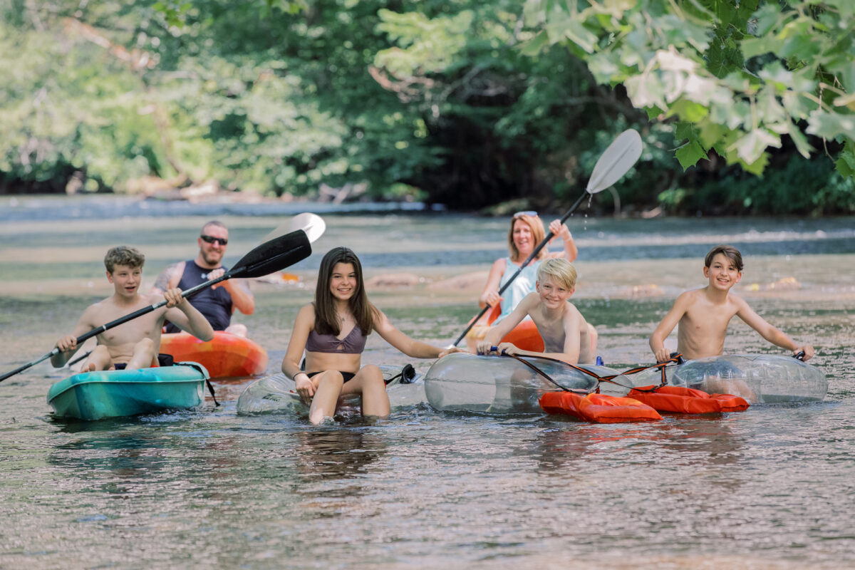 family tubing and kayaking on the river